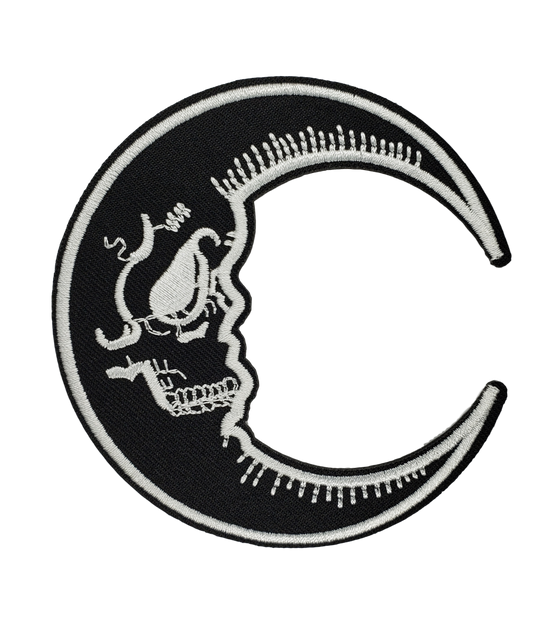 Crescent Moon patch with skull face, black and white.